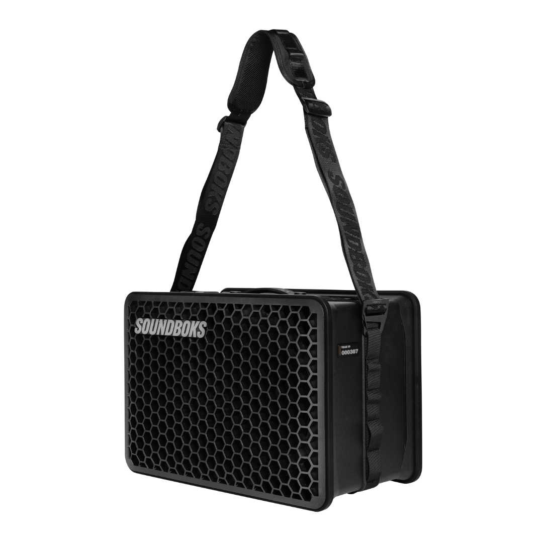 SOUNDBOKS Go with a carrier strap